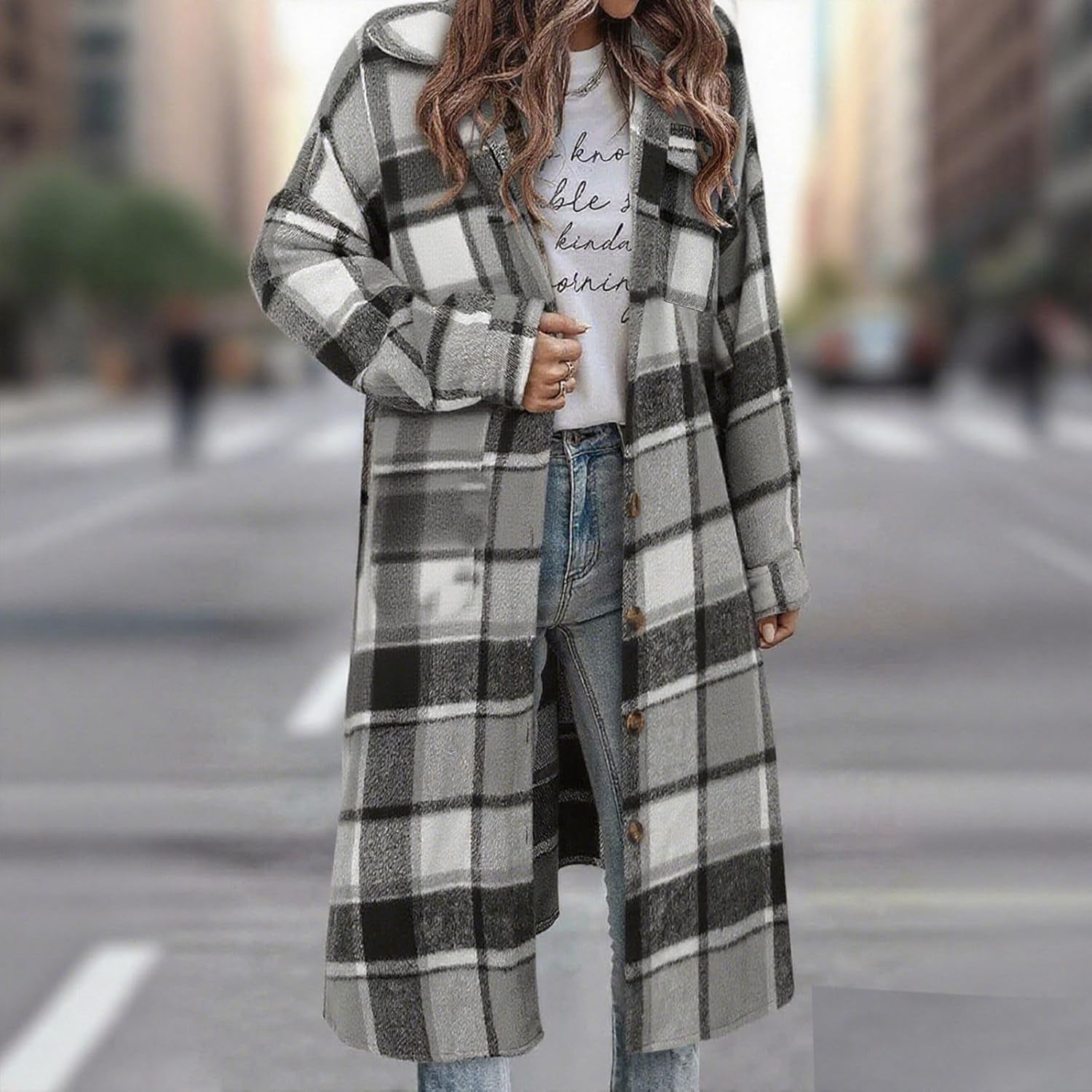 Woman wearing oversized plaid flannel shacket unbuttoned