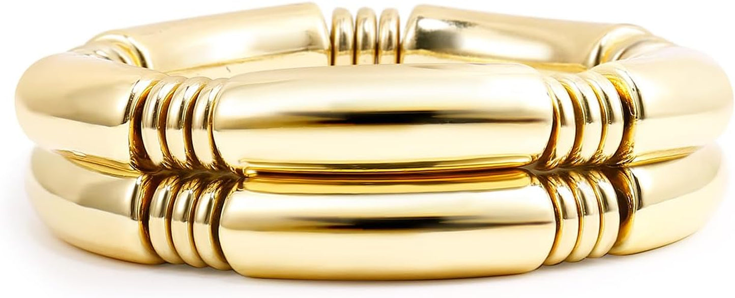 Gold chunky bangle bracelets stacked for statement look