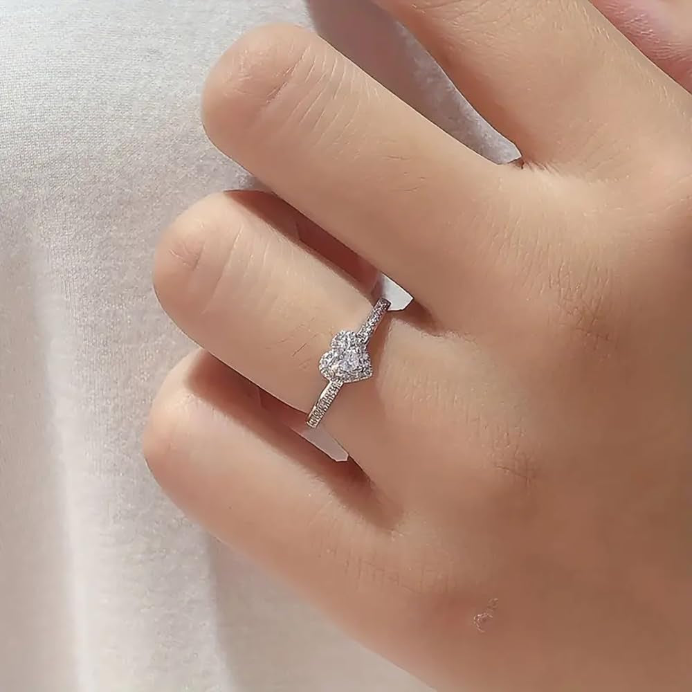 Cubic zirconia wedding band with heart motif detail