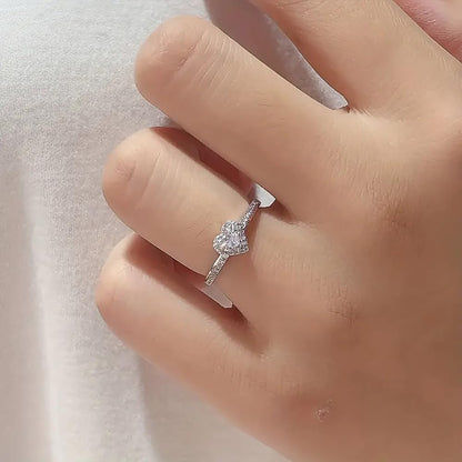Cubic zirconia wedding band with heart motif detail