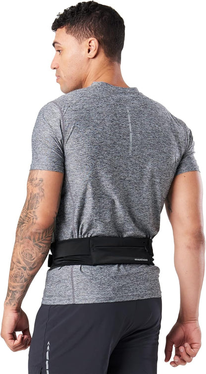 Woman wearing Nathan Zipster belt while trail running