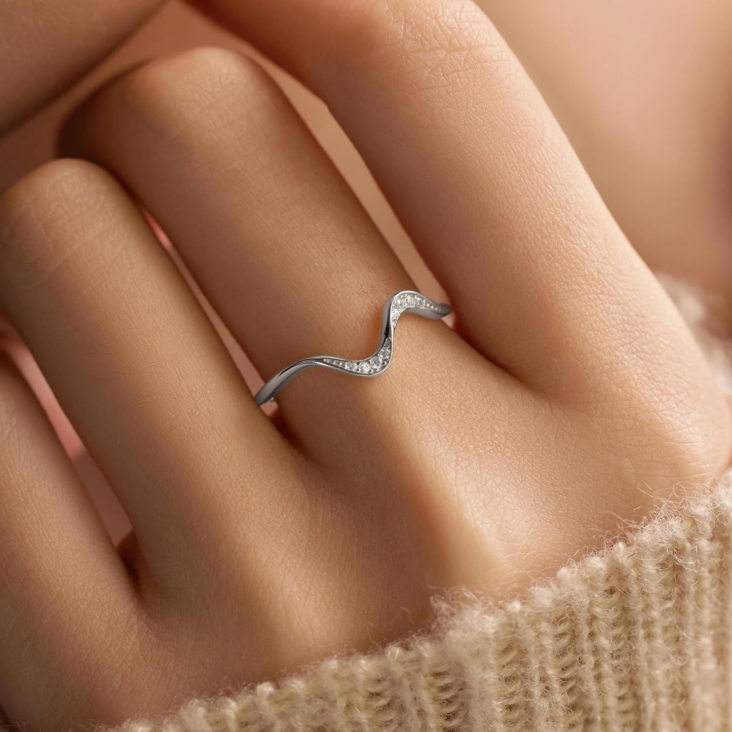 Minimalist wave ring design with cubic zirconia accent