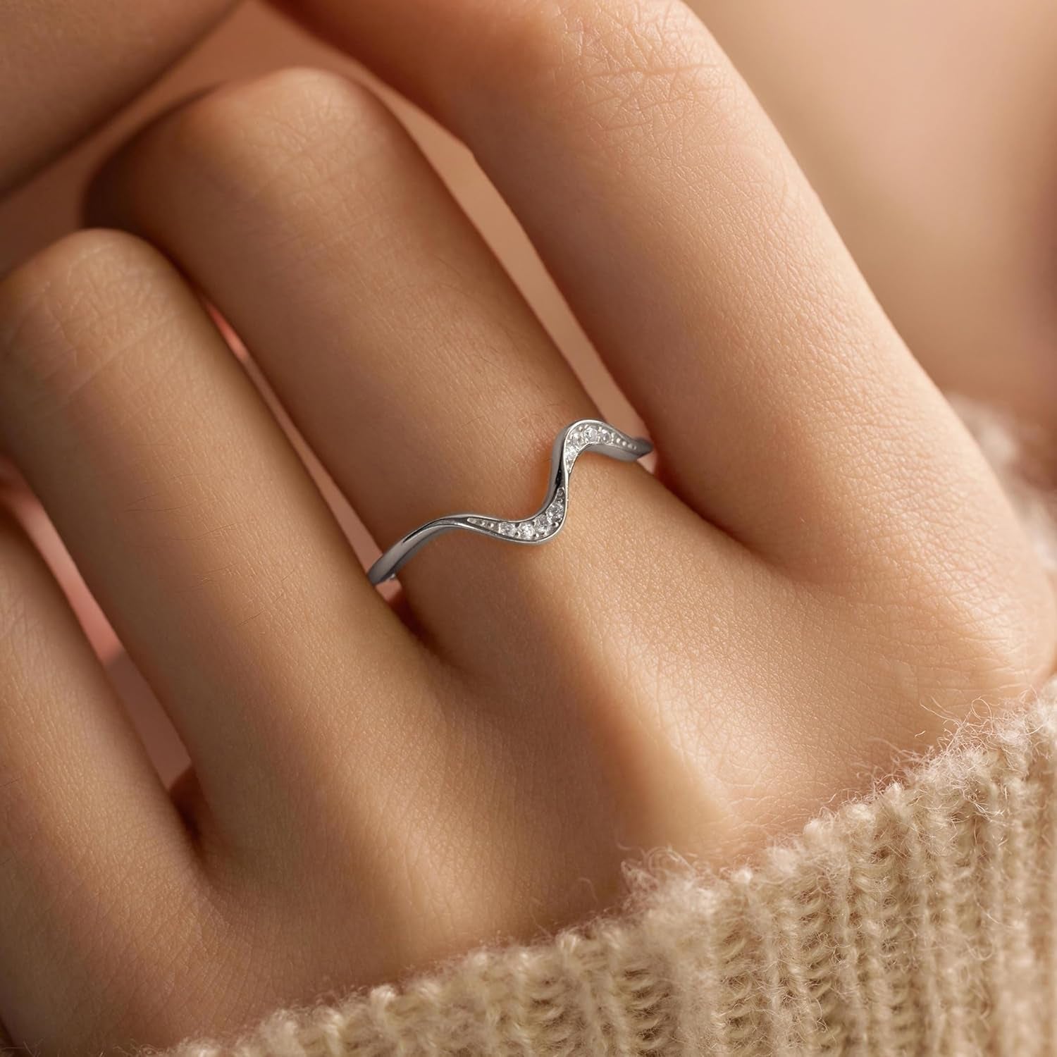 Minimalist wave ring design with cubic zirconia accent