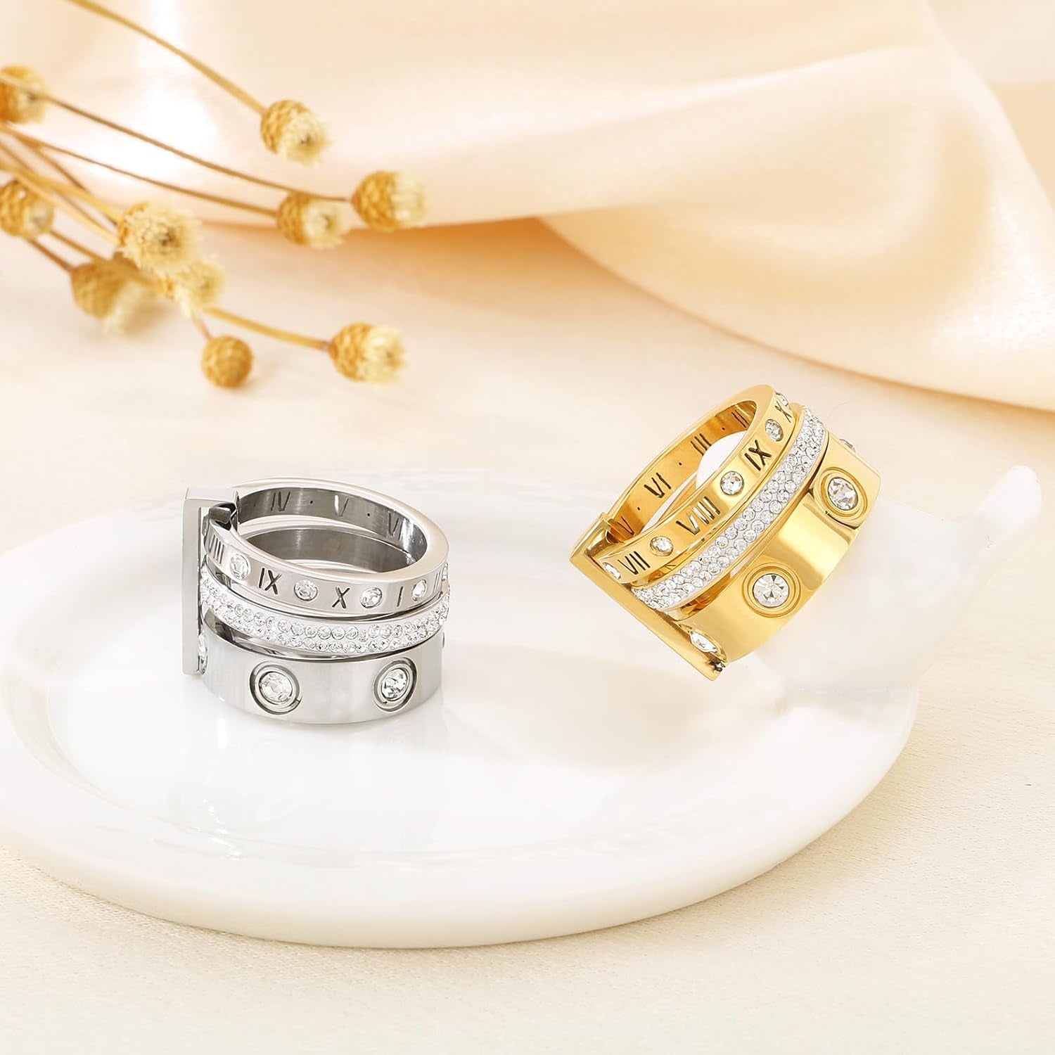 Stainless steel stacking rings worn together on model's hand