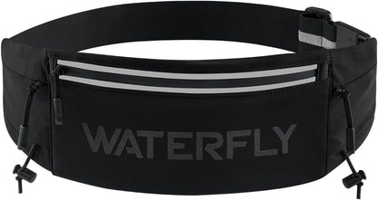 Woman wearing WATERFLY running belt fanny pack during outdoor marathon race