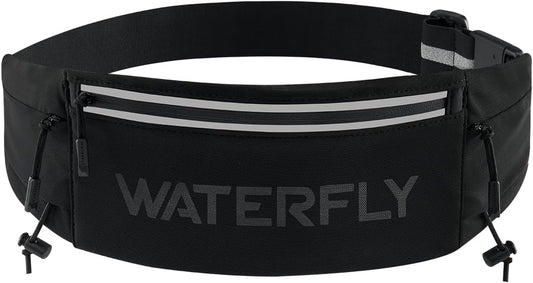 Woman wearing WATERFLY running belt fanny pack during outdoor marathon race