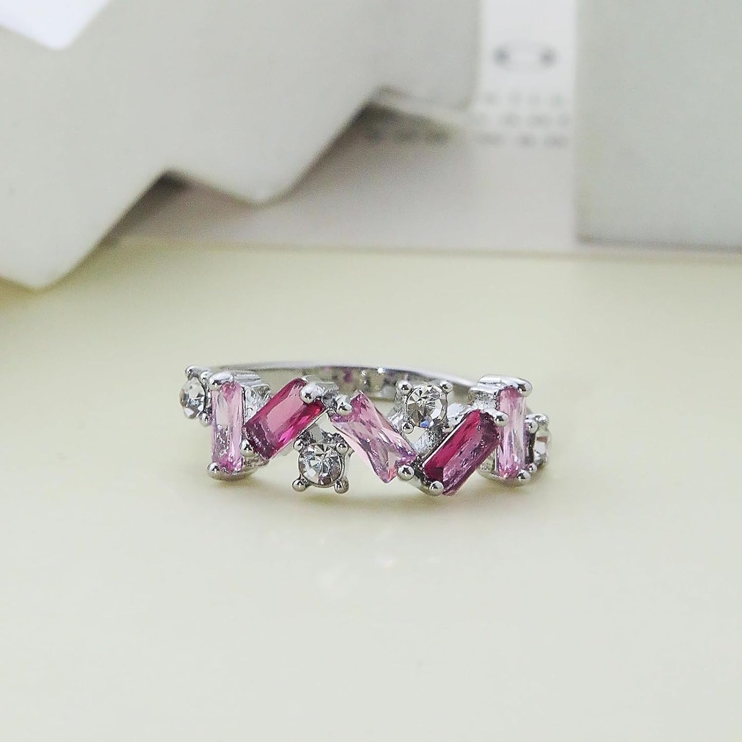 Irregular shaped pink crystal band ring with positive message