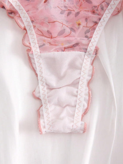 Woman wearing floral low rise thong panties comfortable fit demonstration