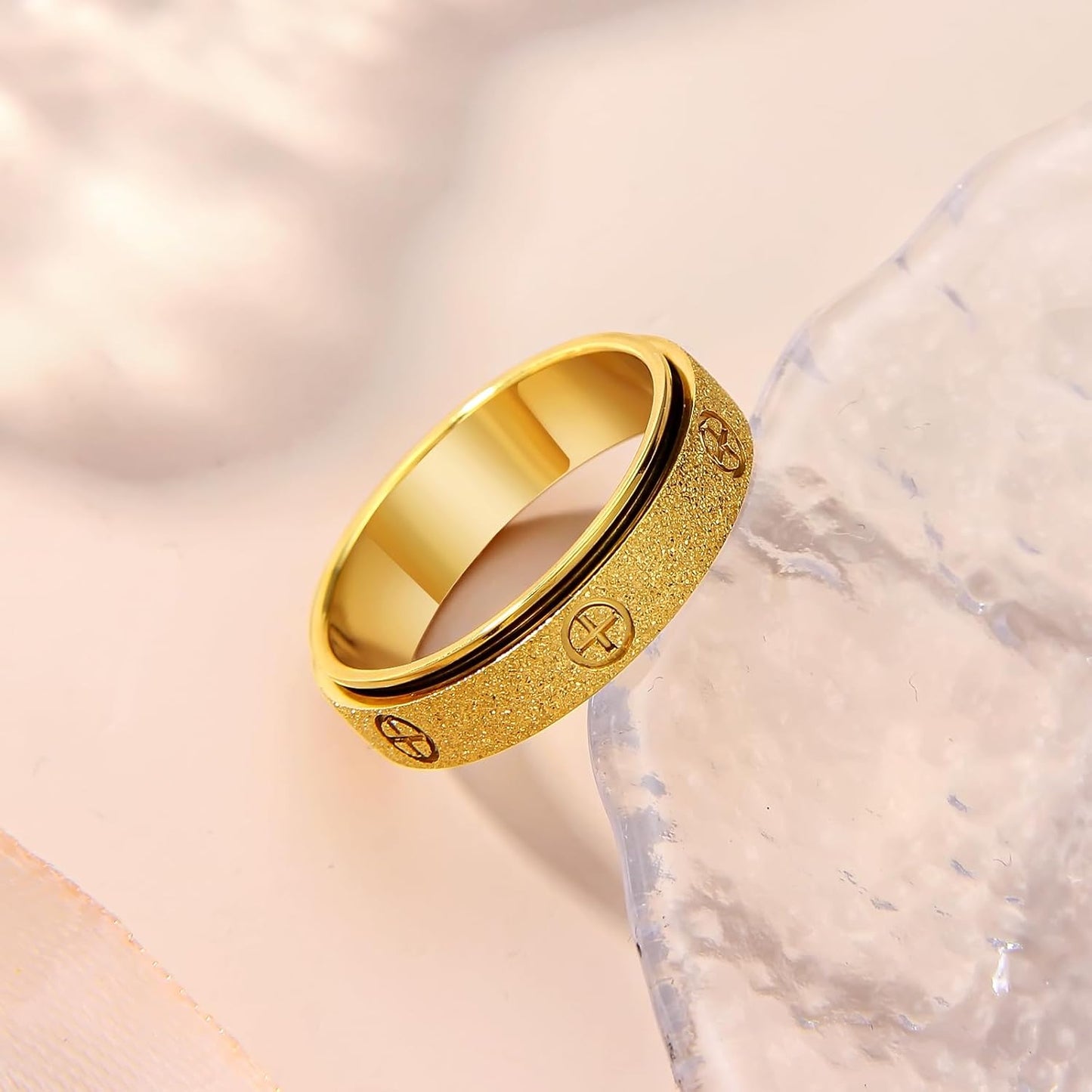 Cross fidget ring with three-dimensional design for smooth rotation