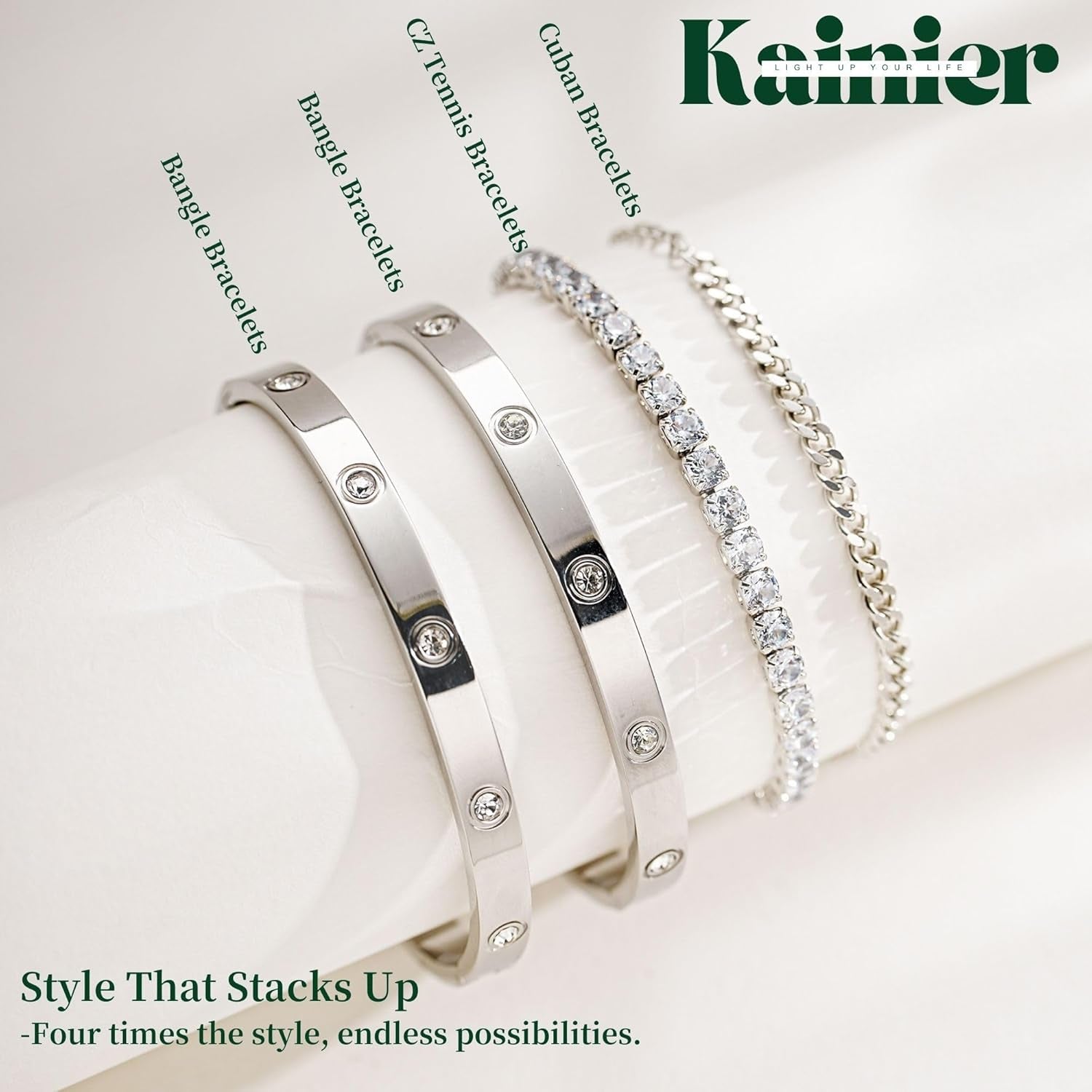 Mixed gold and silver bracelets stacked on woman's wrist together