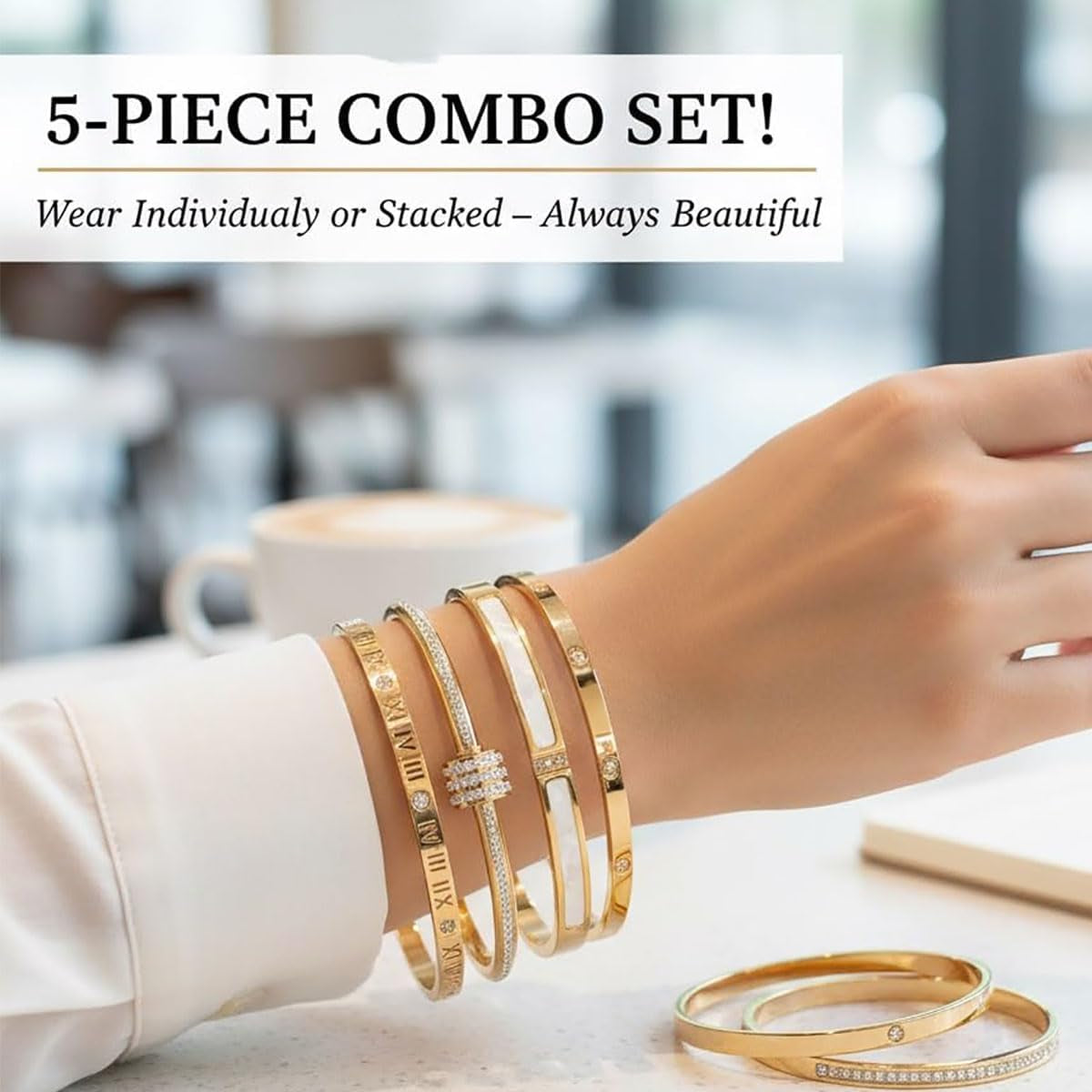 Close-up of elegant stainless steel bracelets in gold finish with classic design