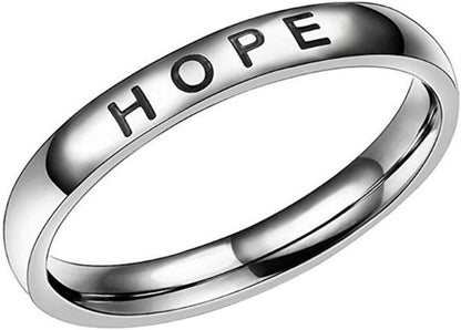 Mantra wedding band ring worn on woman's hand with faith and hope message