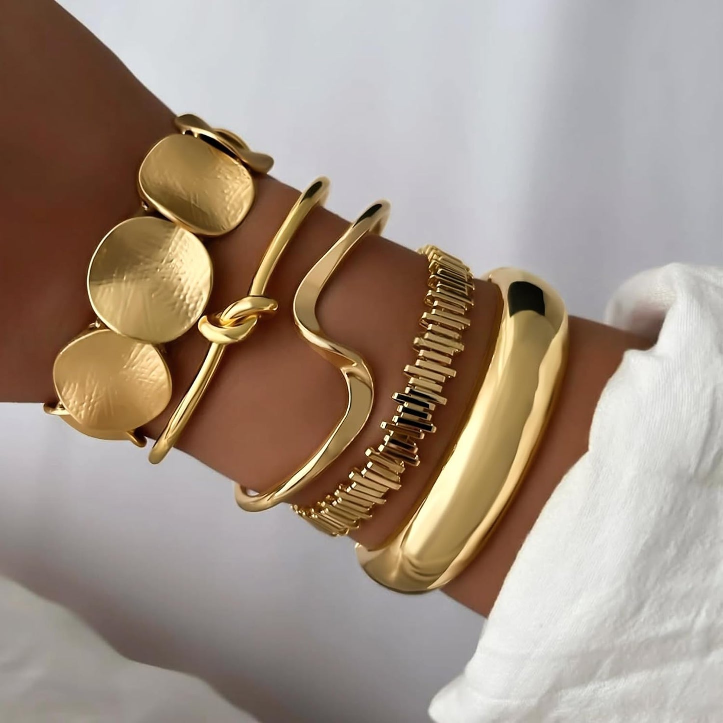 Multi-layer twisted texture gold cuff bracelets stacked