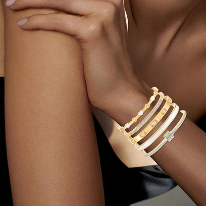 Multiple stackable heart bangles in gold plating