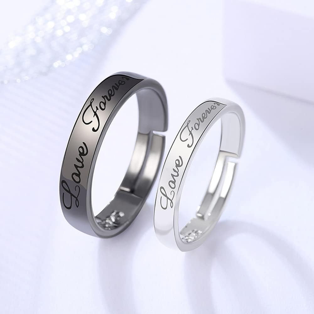 Black and white stackable promise rings worn together on hands showing adjustable fit
