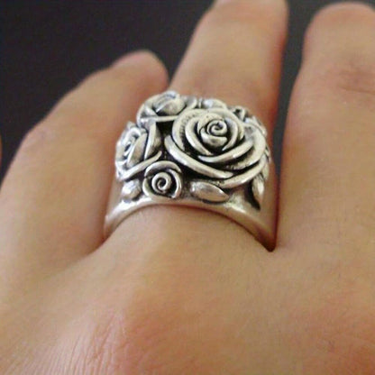 Detailed rose petal design ring in white gold with crystal accents