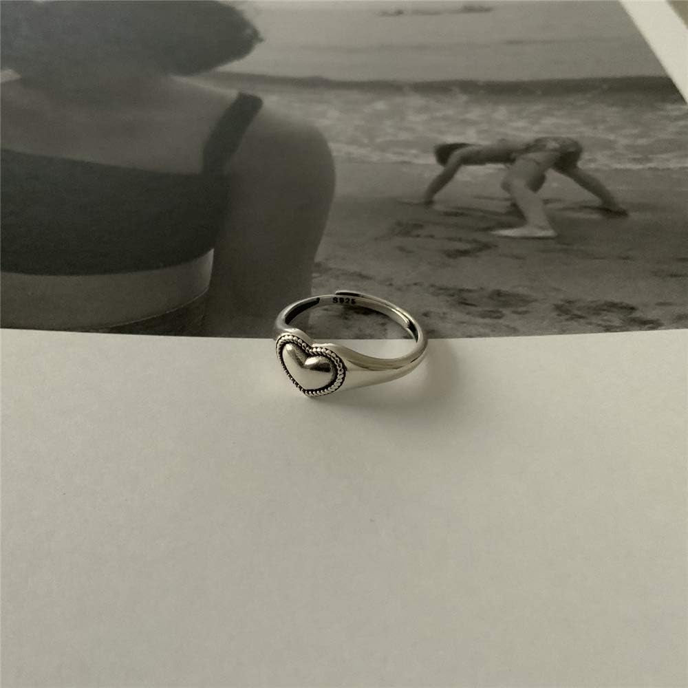 Expandable vintage heart statement ring showing adjustable fit