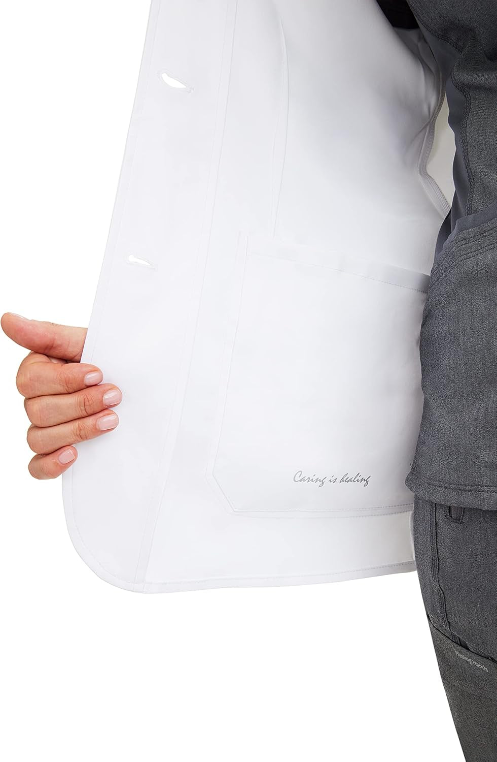 Detail of pocket placement and button front design on lab coat
