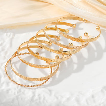 ZOVOLI non-tarnish bracelet stack in timeless gold tone finish