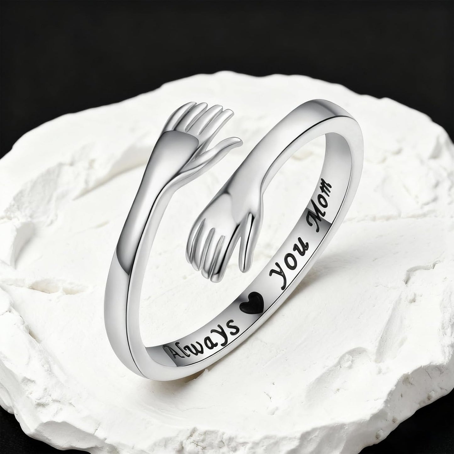 Sterling silver hug ring styled on woman's finger