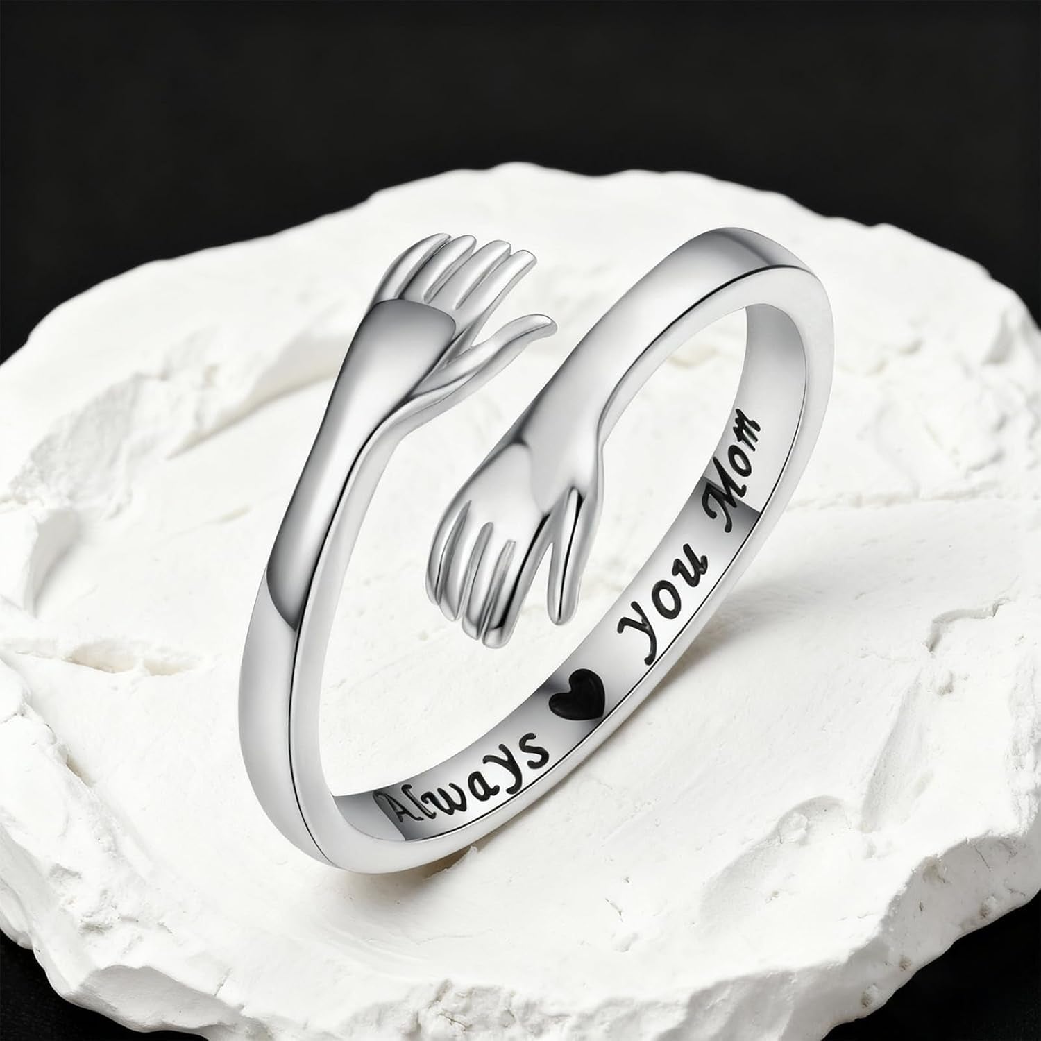 Sterling silver hug ring styled on woman's finger
