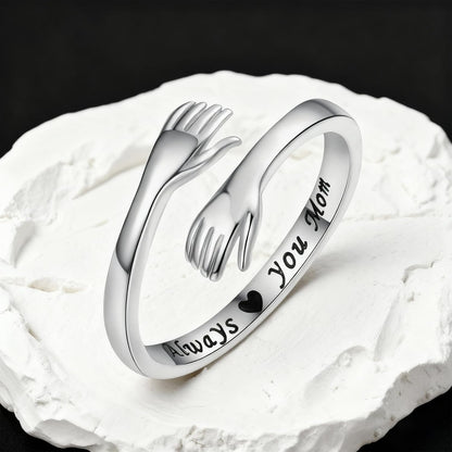Sterling silver hug ring styled on woman's finger