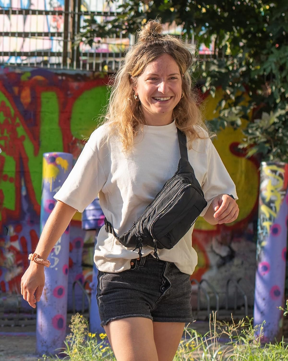 WATERFLY fanny pack filled with phone, cards, cash, and travel essentials