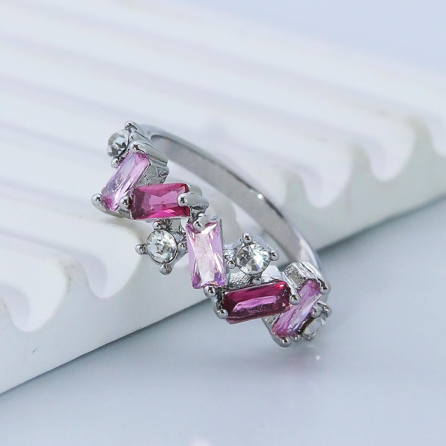 Pink crystal self love ring displayed on woman's hand