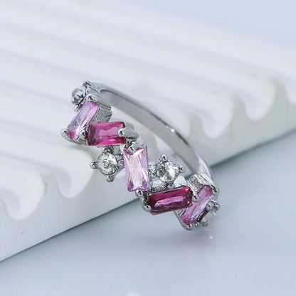 Pink crystal self love ring displayed on woman's hand