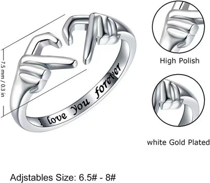 Heart ring with hugging hands symbol of eternal friendship