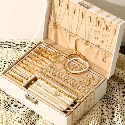 Close-up of gold chain necklaces from complete jewelry set