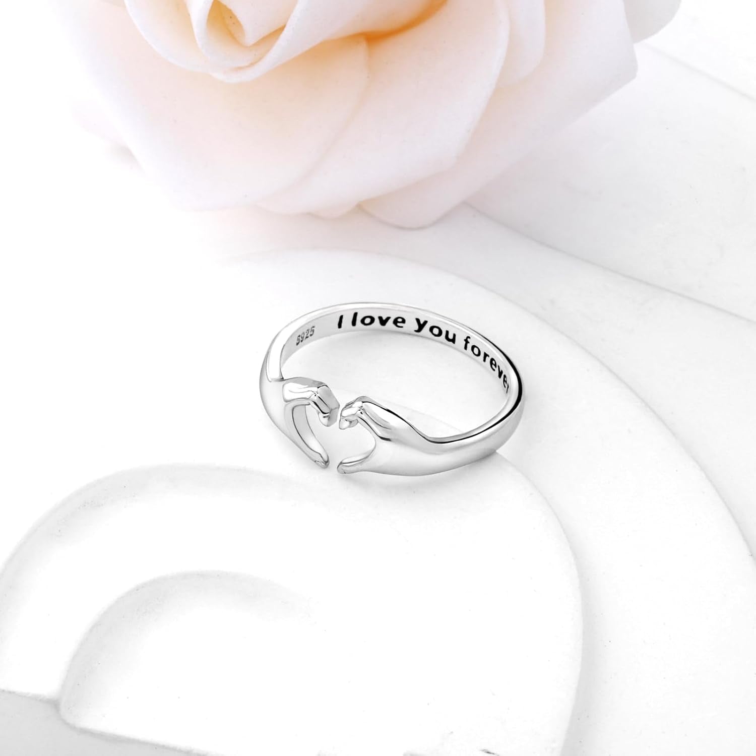 Heart hands ring with I Love You Forever engraving on woman's finger
