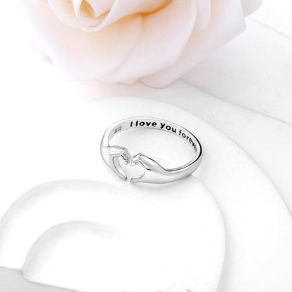Heart hands ring with I Love You Forever engraving on woman's finger