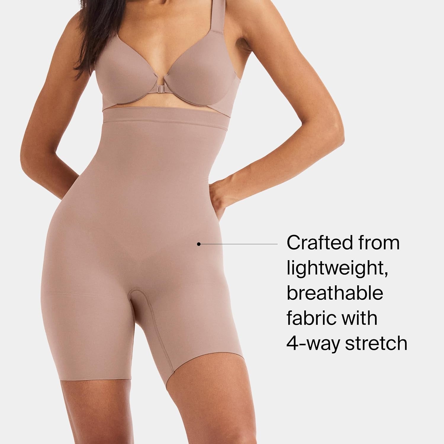 Side angle showing SPANX mid-thigh shapewear compression details