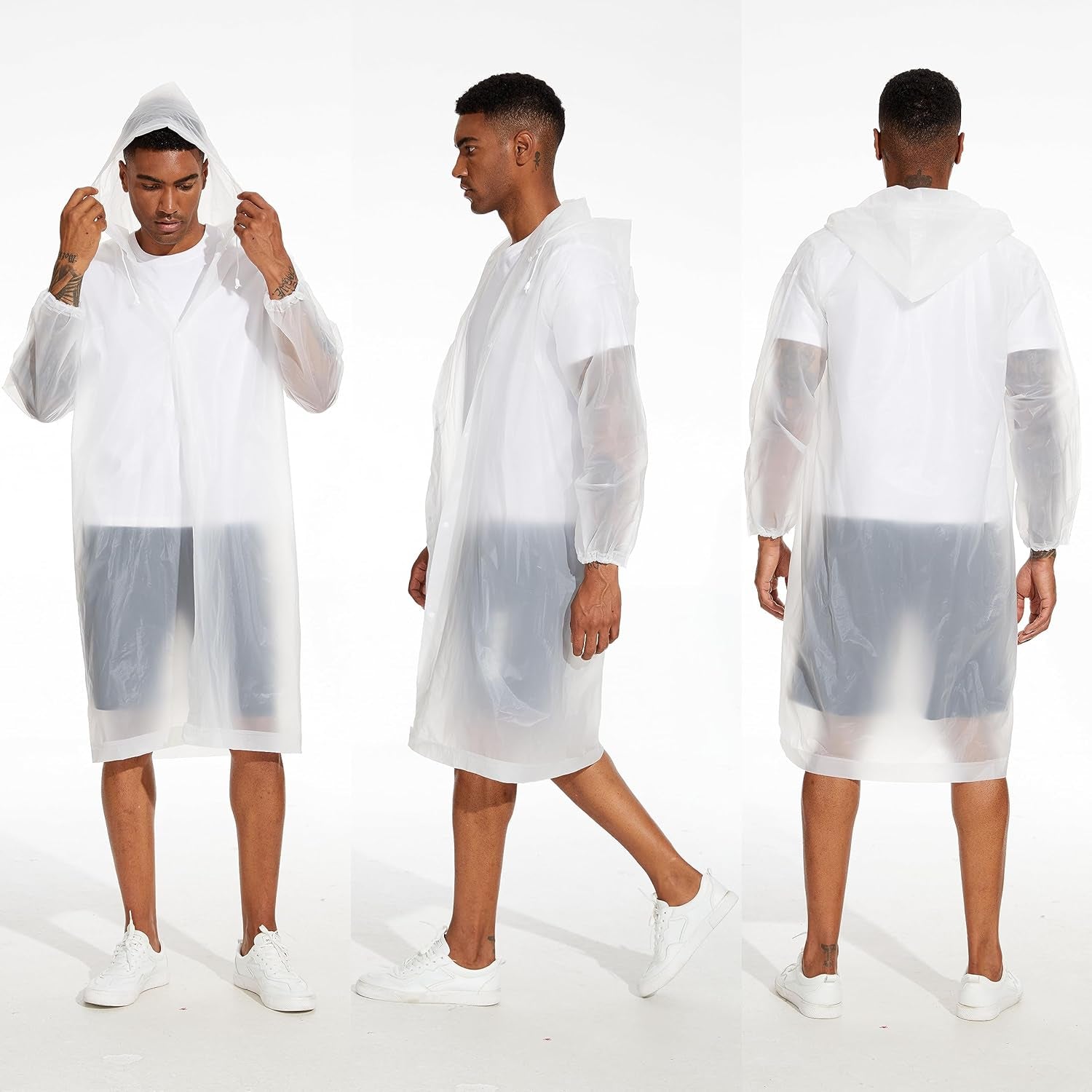 Person wearing hooded rain poncho in heavy downpour weather