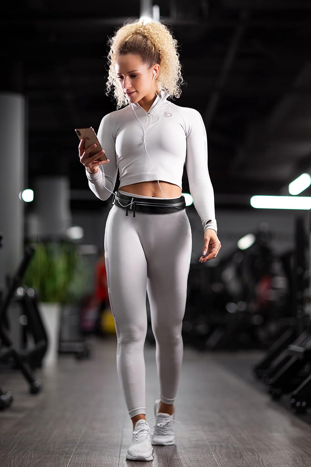 Phone holder running belt in use during hiking and outdoor activities