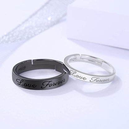 Close-up of engraved Love Forever text inside matching promise rings