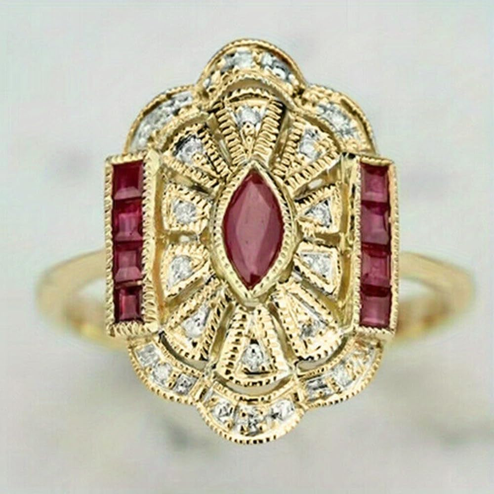 Gold plated statement ring on female hand close-up view