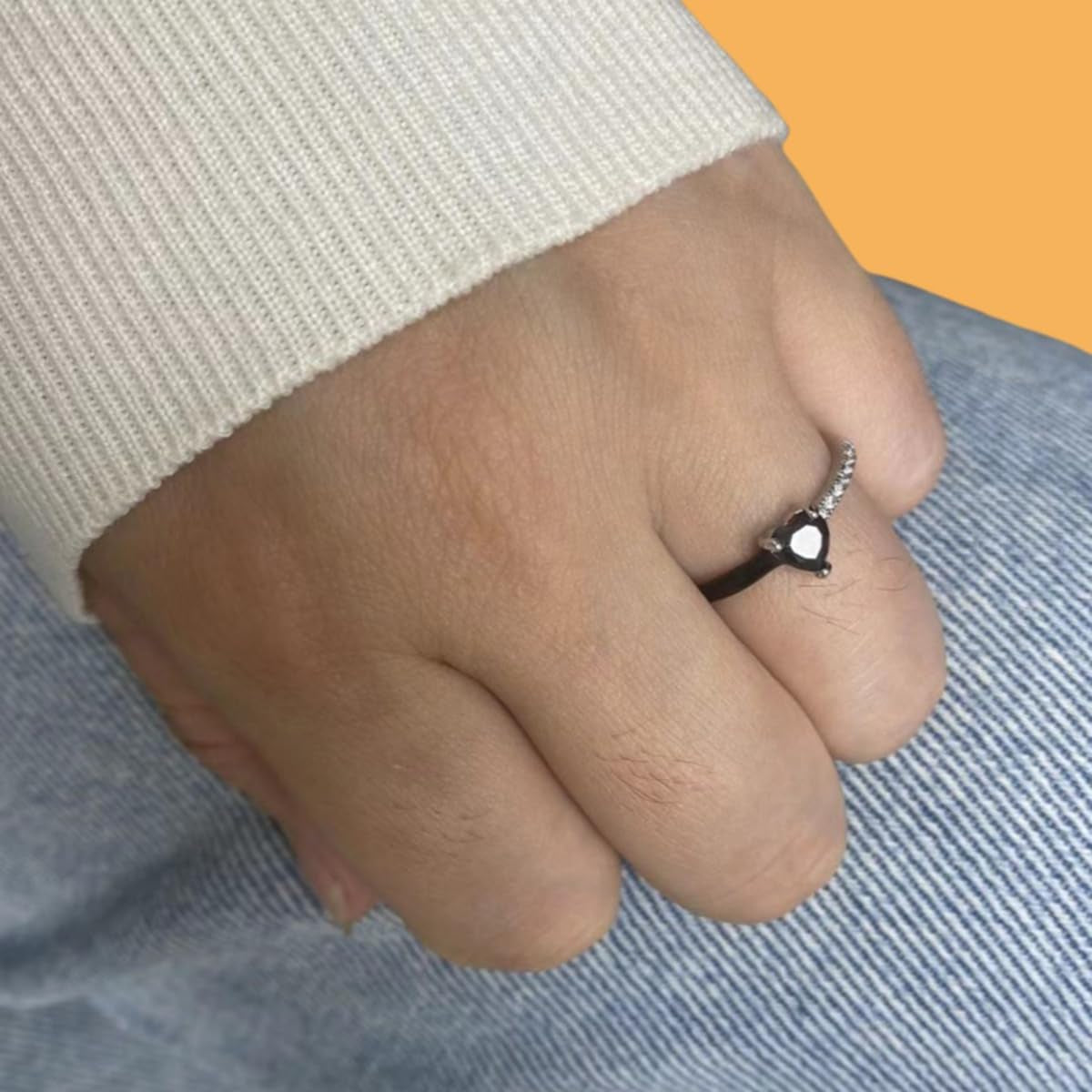 Black heart enamel ring displayed on white background