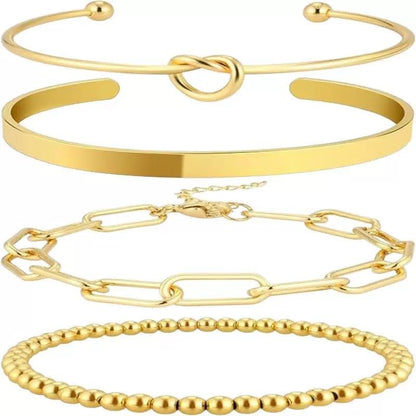 14K gold plated dainty cuff bracelets stacked on womens wrist