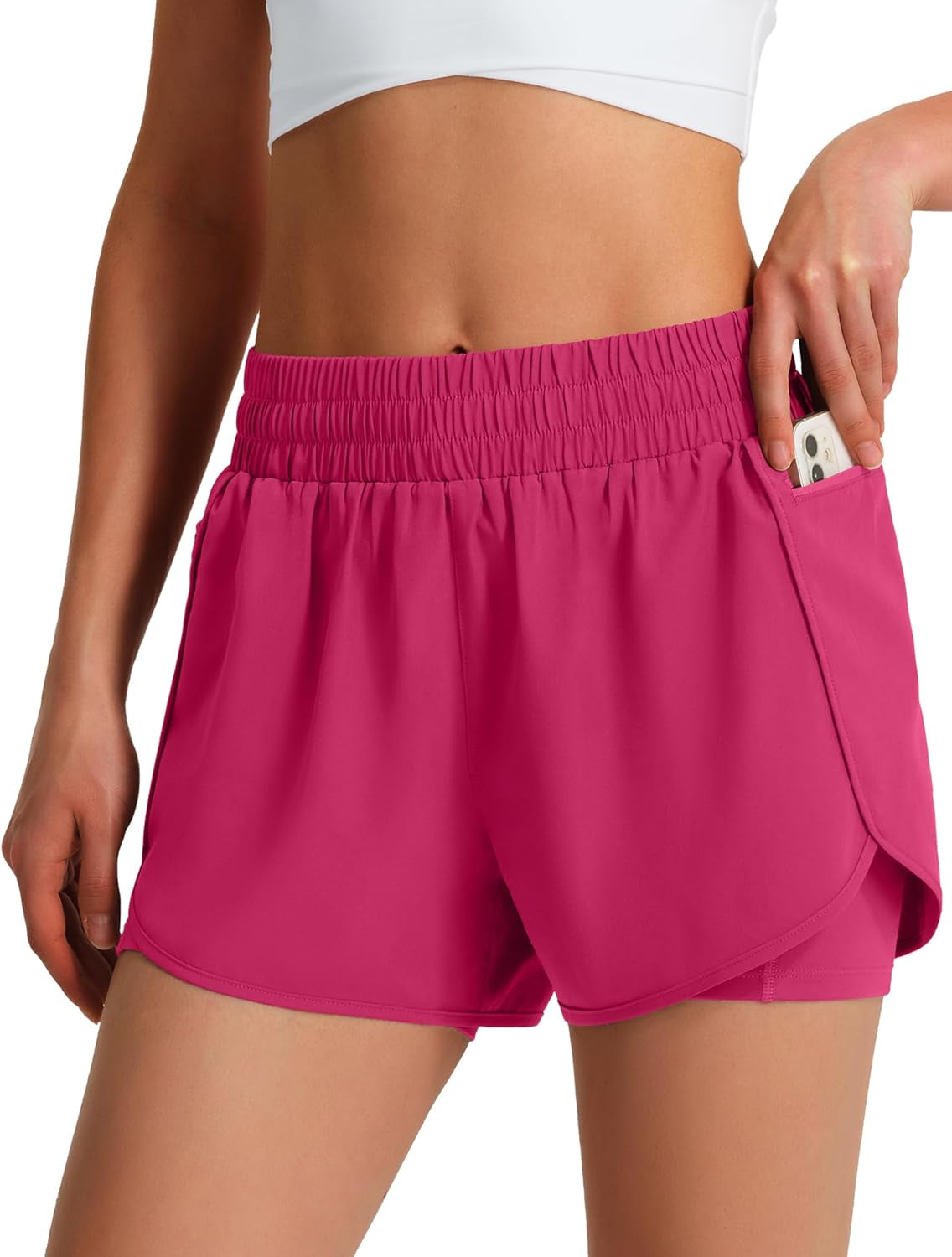 Athletic running shorts with phone pockets on female athlete