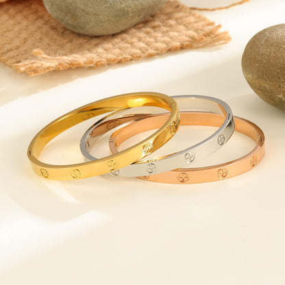 Stackable gold plated love bracelets in various metallic finishes