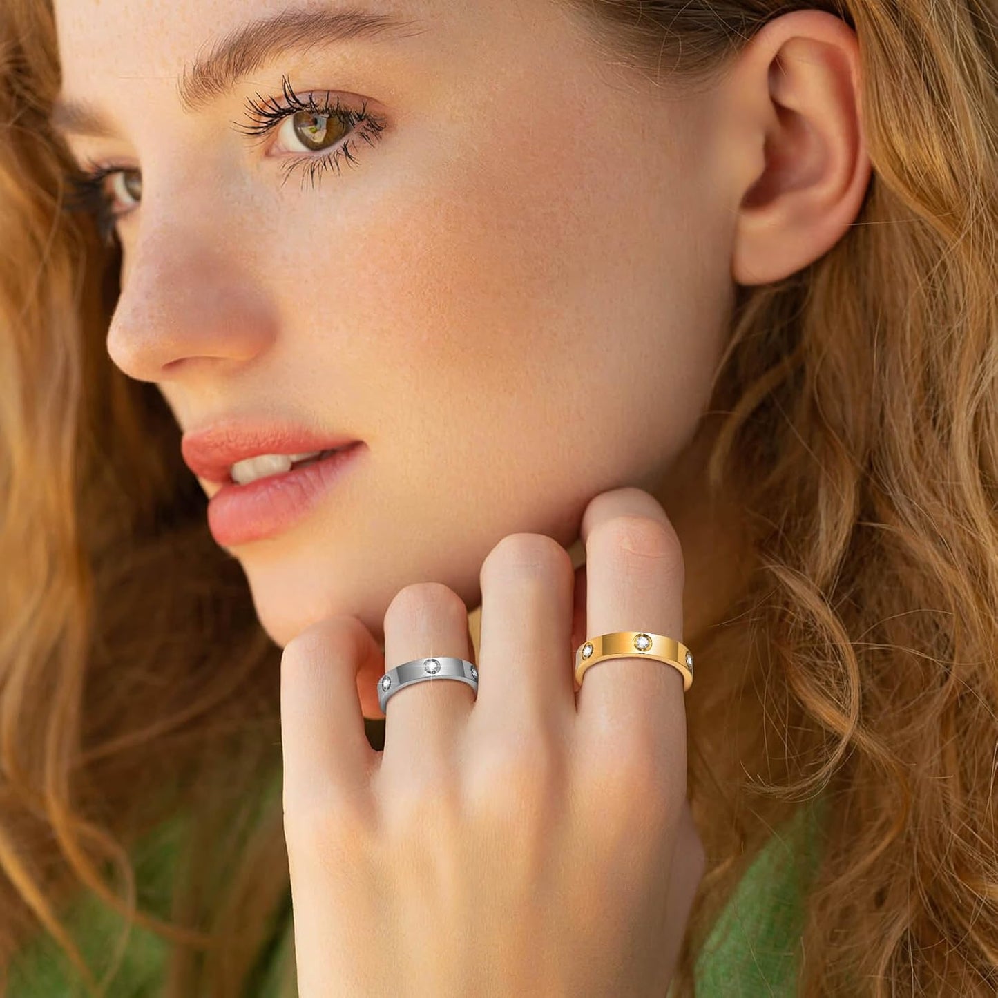 Woman wearing gold cubic zirconia ring on hand close-up