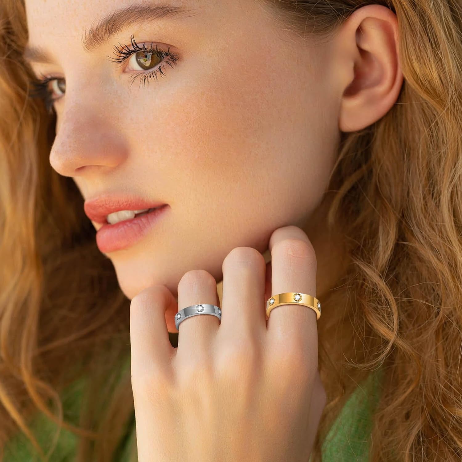 Woman wearing gold cubic zirconia ring on hand close-up