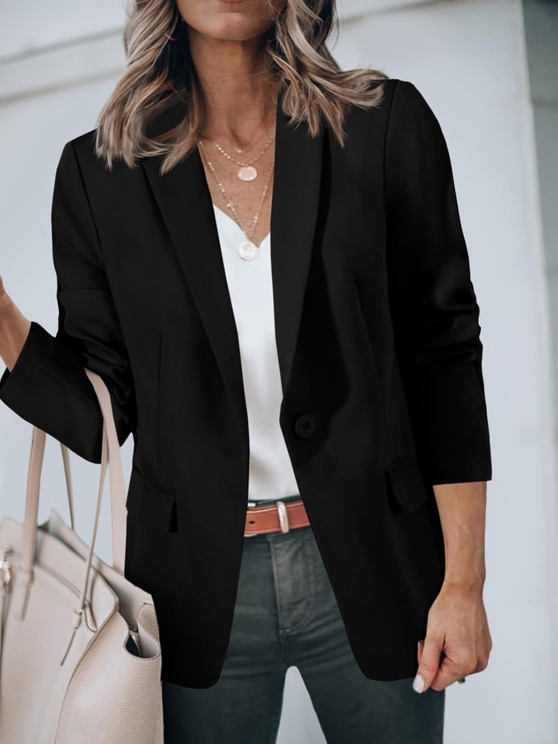 Woman wearing open front casual blazer over casual dress