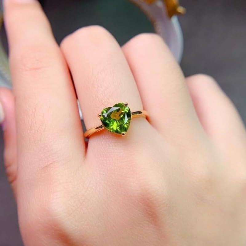 Close-up of 8x8mm peridot gemstone in silver ring setting