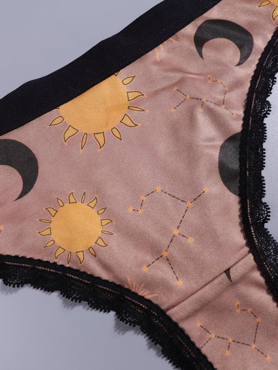 Gold lace trim detail on celestial print thong underwear