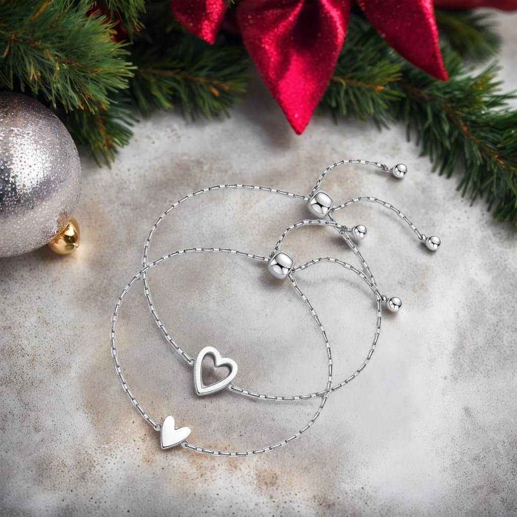 Two gold heart friendship bracelets displayed as a gift set