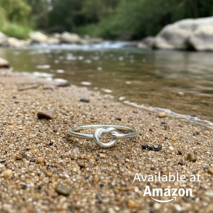 Sterling silver knot ring worn on hand