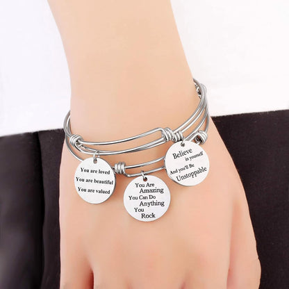 Stainless steel motivational message charm bracelet close-up